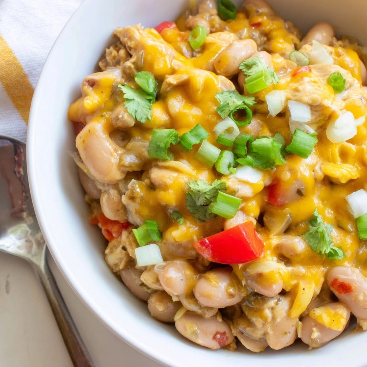 Savory Cajun Chicken Cheddar Pintos recipe—comfort food ready to serve for dinner.