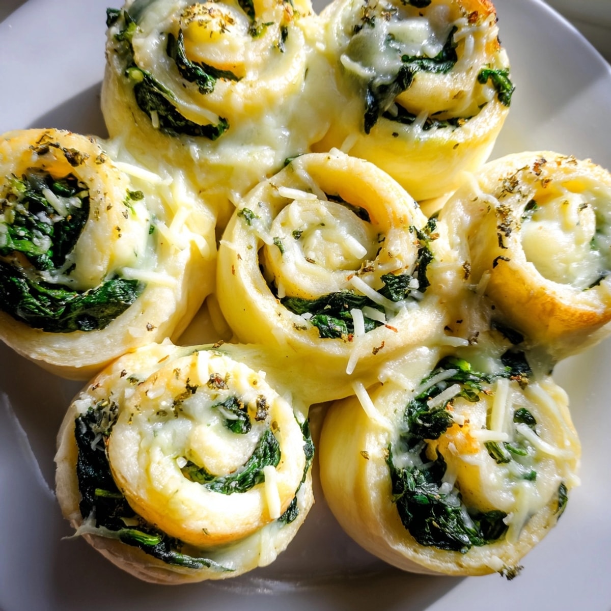 Golden Alfredo Garlic Spinach Pizza Rolls, fresh from the oven and ready to serve.