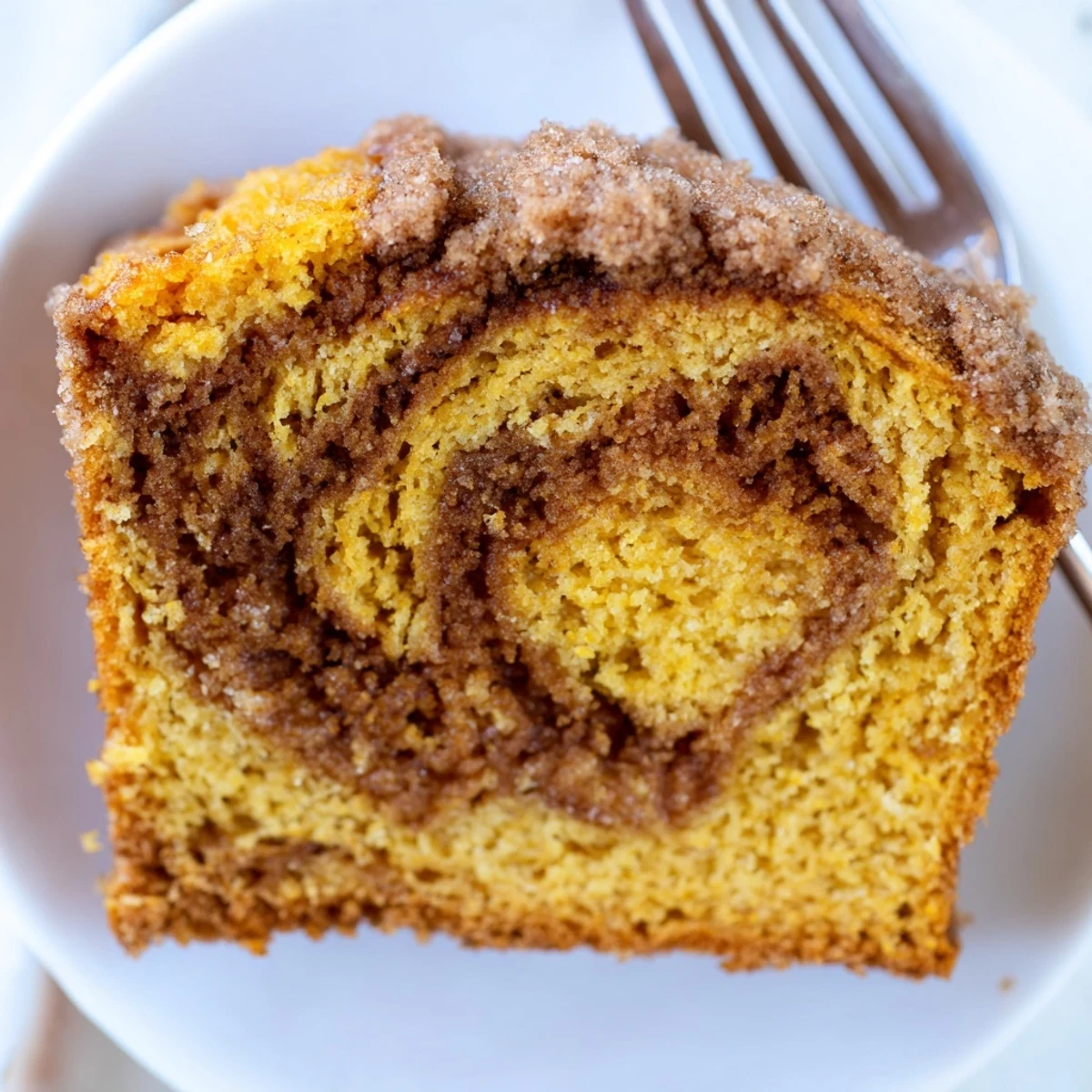 Sliced Churro Pumpkin Snickerdoodle Bread showcases warm spices and sweet cinnamon swirls.  