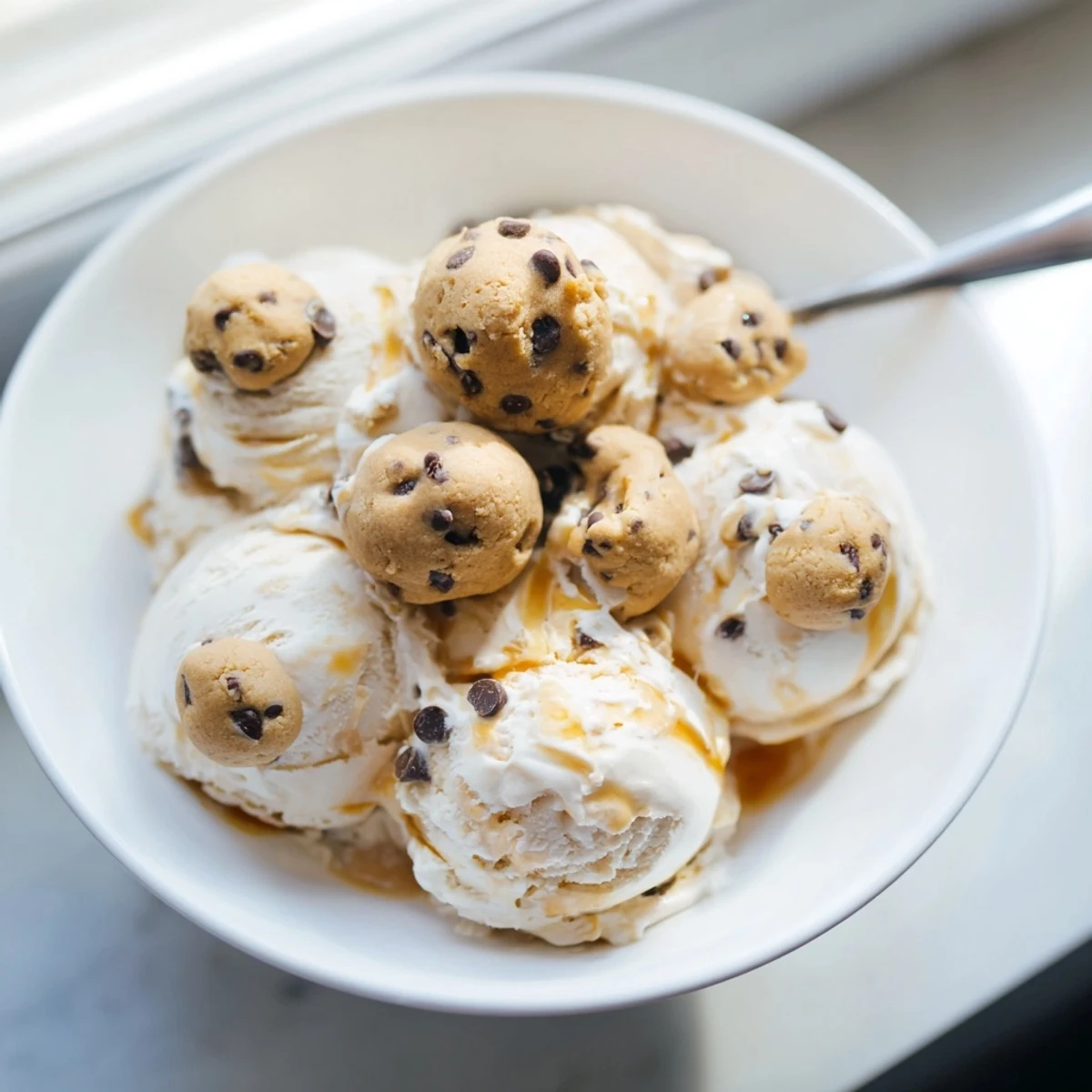 Guilt-free cottage cheese ice cream topped with rich chocolate chip cookie dough chunks.