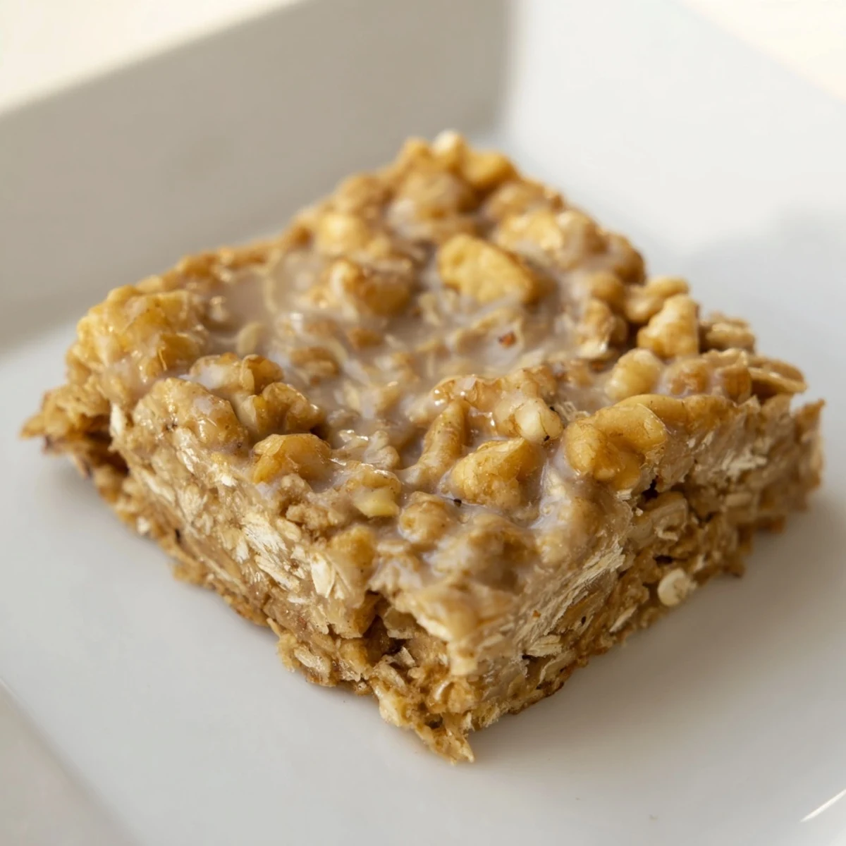 Golden Maple Cinnamon Oatmeal Bars, freshly baked and ready for a delicious grab-and-go breakfast.