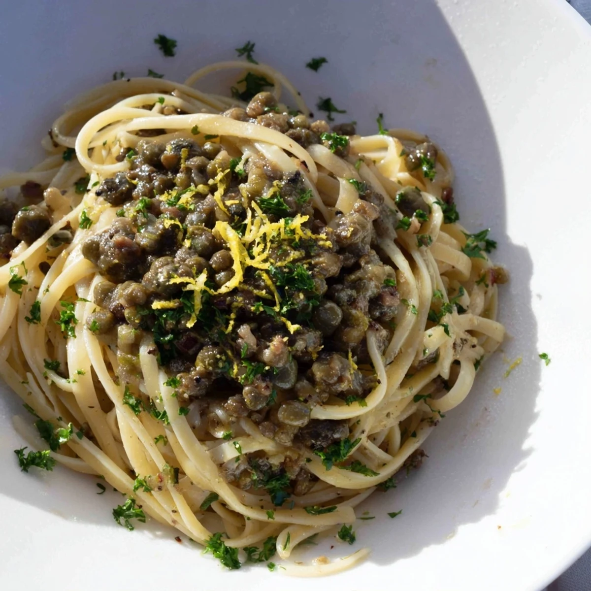 A bowl of Olive Tapenade Pasta, a delightful Mediterranean pasta dish with olives and herbs.