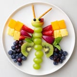 This refreshing Butterfly Fruit Tray features sweet berries and melon, artfully arranged on a platter.