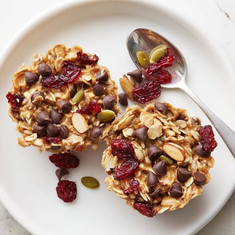 Homemade Peanut Butter Trail Mix Breakfast Cups with chocolate chips, nuts, and dried fruit.