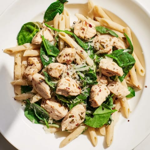 Savor the flavors of this One-Pot Spinach and Chicken Pasta brimming with Italian herbs and cheese.