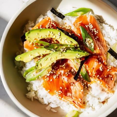Warm classic salmon rice served with seaweed wraps; experience this delicious Asian inspired dish.