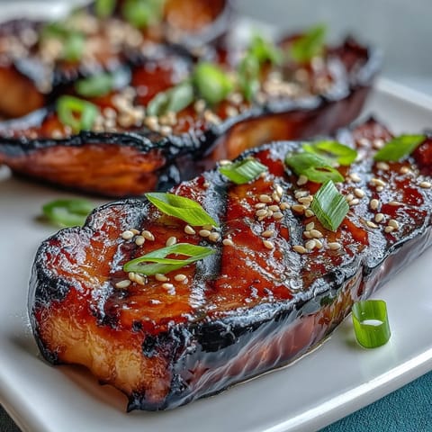 Rich and savory miso glazed eggplant, roasted to tender perfection with a sweet umami coating.